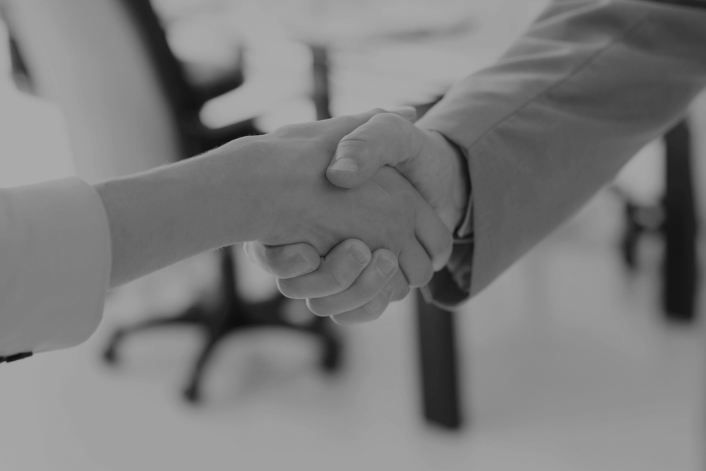 Close-up of shaking hands after a business meeting in the office